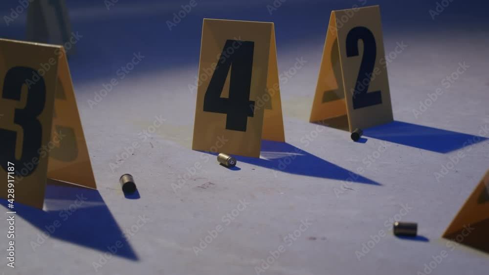 Police Crime Scene with Bullet Casings and Evidence Markers