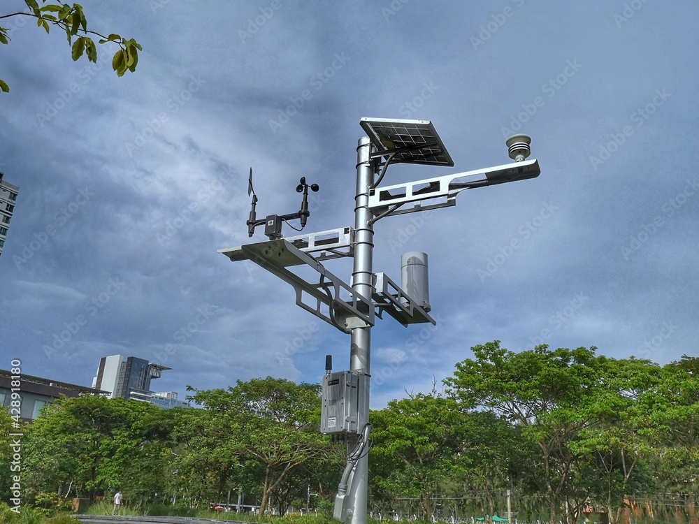 Automatic weather station, with a weather monitoring system in the park. Automatic weather station, with a weather monitoring system in the park.