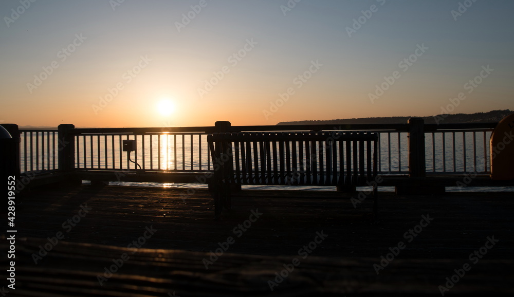Watching sunset thru rail of Jorgensen Pier in Semiahmoo Bay