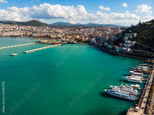 View from drone of large resort town of Kusadasi on Turkey Aegean coast on sunny day, Aydin Province © JackF