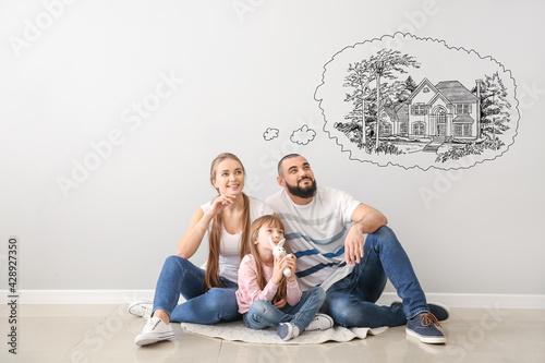 Young family dreaming about moving into new house