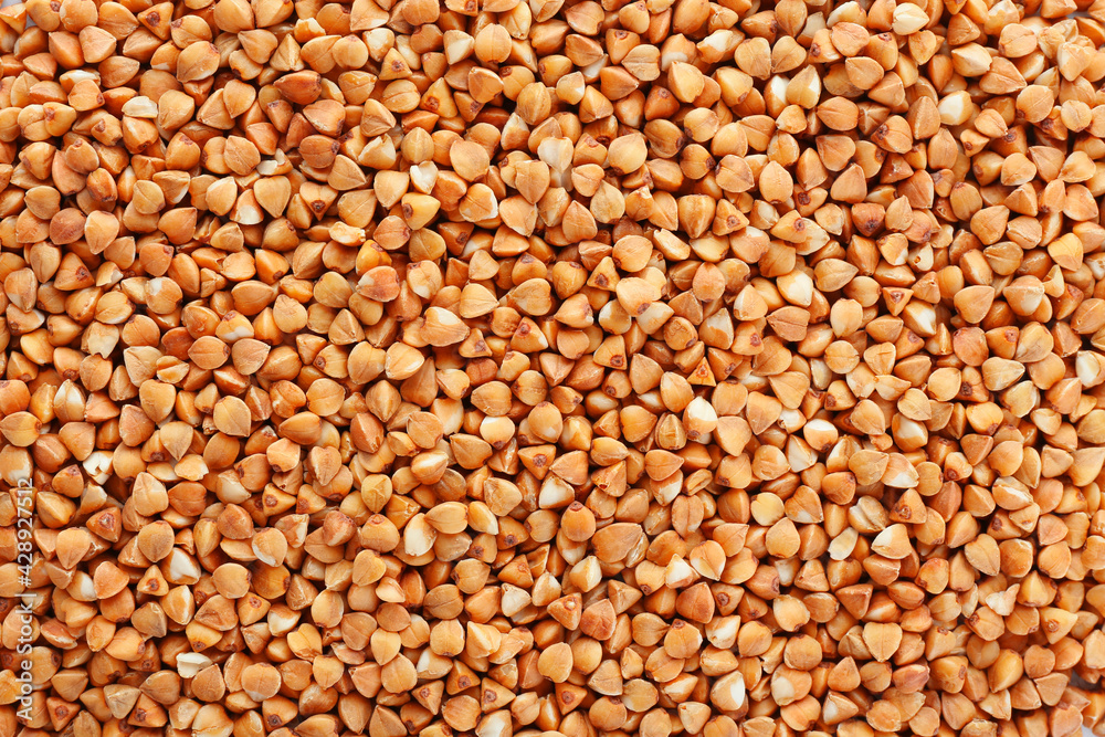 Heap of dry roasted buckwheat as background Heap of dry roasted buckwheat as background