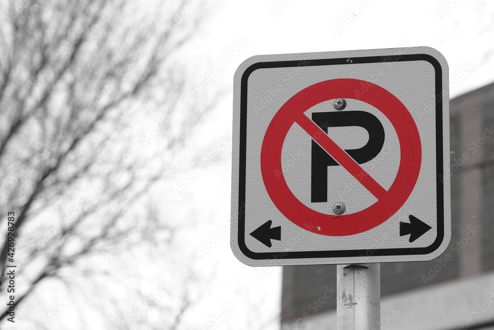 No parking sign on roadside - Red on monchrome No parking sign on roadside - Red on monchrome