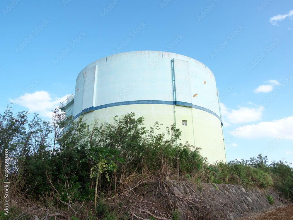 Okinawa,Japan-October 30, 2020: Big cylindrical water storage tank supplying water to the people in Irabu island, Japan
Okinawa,Japan-October 30, 2020: Big cylindrical water storage tank supplying water to the people in Irabu island, Japan