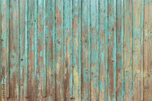 Blue Painted Wooden Peeling Off Fence. Rough Texture Background.