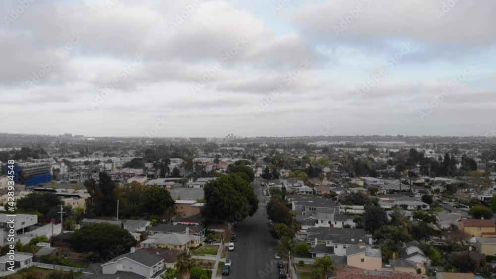 Aerial Flight Above Buildings And Street In Culver City Neighborhood, Los Angeles With Overcast On A Sunset. Aerial Flight Above Buildings And Street In Culver City Neighborhood, Los Angeles With Overcast On A Sunset.