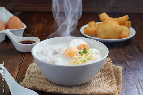 Boiled rice or porridge with pork for breakfast, cooked eggs, Pa