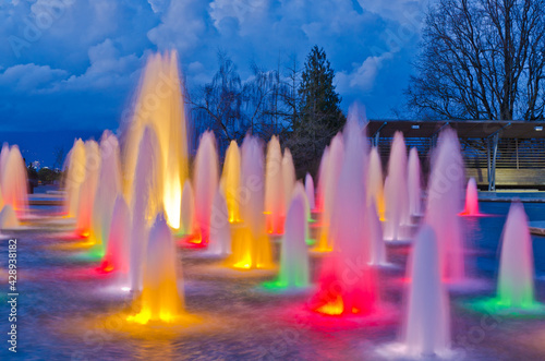 Night view at fountain in Queen Elizabeth park over mountain and cloudy sky in Vancouver, Canada.