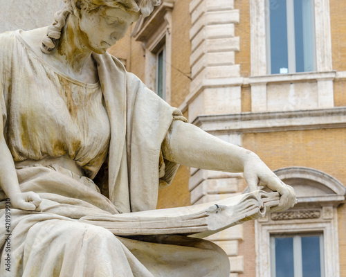 Fragment of statue at Fontana del Moro in Piazza Navona, Famous square filled with fountains in the heart of Rome, capital of Italy photo