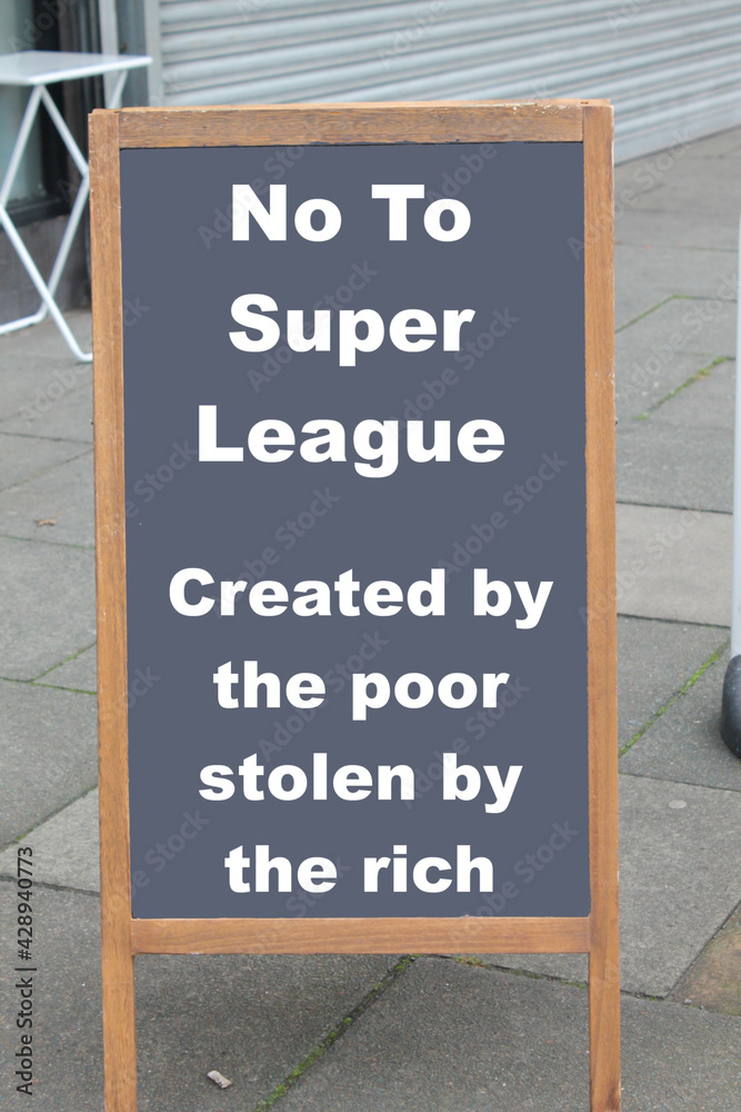 No to super league football, created by the poor stolen by the rich text on a chalk board. Football fans message concept