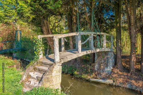 An old entrance door on the small bridge over canal in Amiens  France.