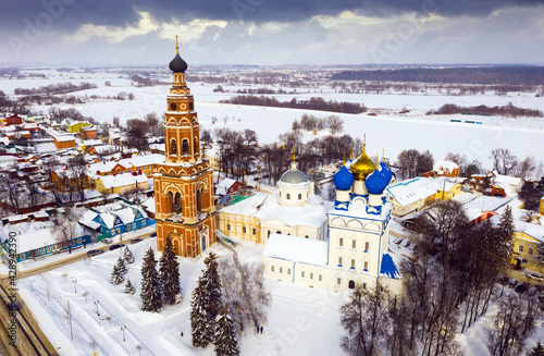 Cathedral complex of Bronnitsy in Moscow region, Russia. View of The Bell Tower and church of the Archangel Michael in winter time photo