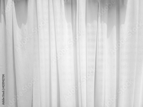 Soft white curtains are simple yet elegant for graphic design or wallpaper