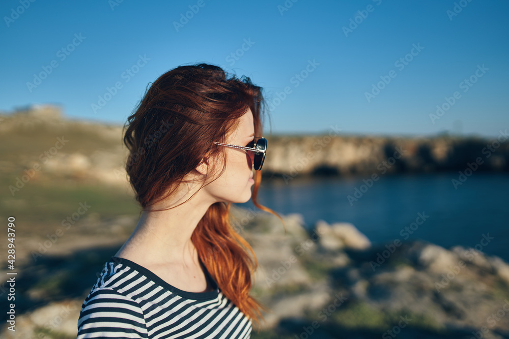 portrait of a woman in the mountains outdoors in summer t-shirt glasses landscape portrait of a woman in the mountains outdoors in summer t-shirt glasses landscape