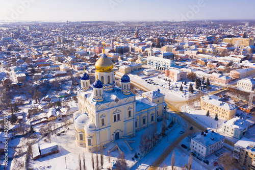 View from drone of Yelets Ascension Cathedral on background with cityscape on sunny winter day, Russia photo