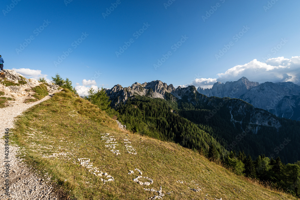 The Julian Alps seen from the Monte Santo di Lussari with the Cima del Cacciatore (Peak of the Hunter) and the mountain range of Jof di Montasio and Jof Fuart. Friuli Venezia Giulia, Italy, Europe.