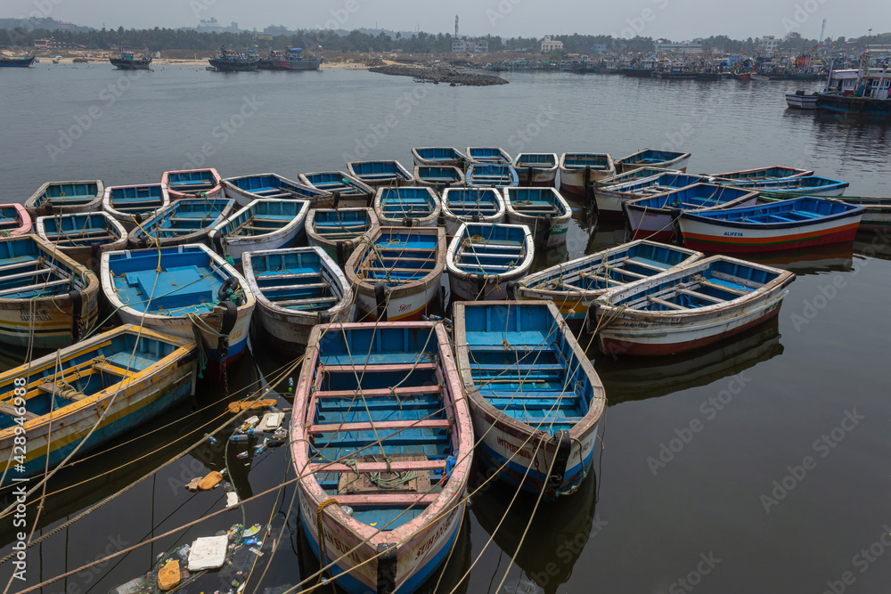 Small boats parked at Mirkarwada jetty fish market, Ratnagiri, Maharashtra, India. Small boats parked at Mirkarwada jetty fish market, Ratnagiri, Maharashtra, India.