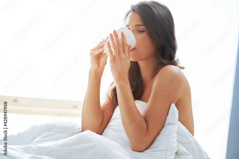 Sensual adult woman in bedroom in the morning Sensual adult woman in bedroom in the morning