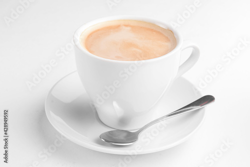 Cup of coffee with milk on a white background. Coffee time, Americano coffee in white cup