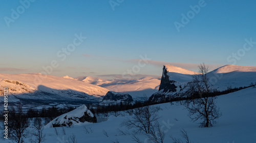 snowy winter landscape of Sarek national park in swedish lappland photo