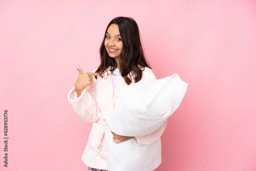 Young woman in pajamas isolated on pink background proud and self-satisfied Young woman in pajamas isolated on pink background proud and self-satisfied