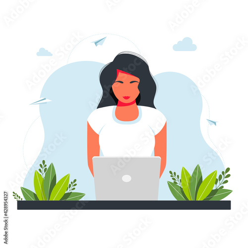 Freelance, online studying, work from home concept. girl sitting with laptop. The girl sits at the table and works on a laptop with a home plant in the background. freelance concept