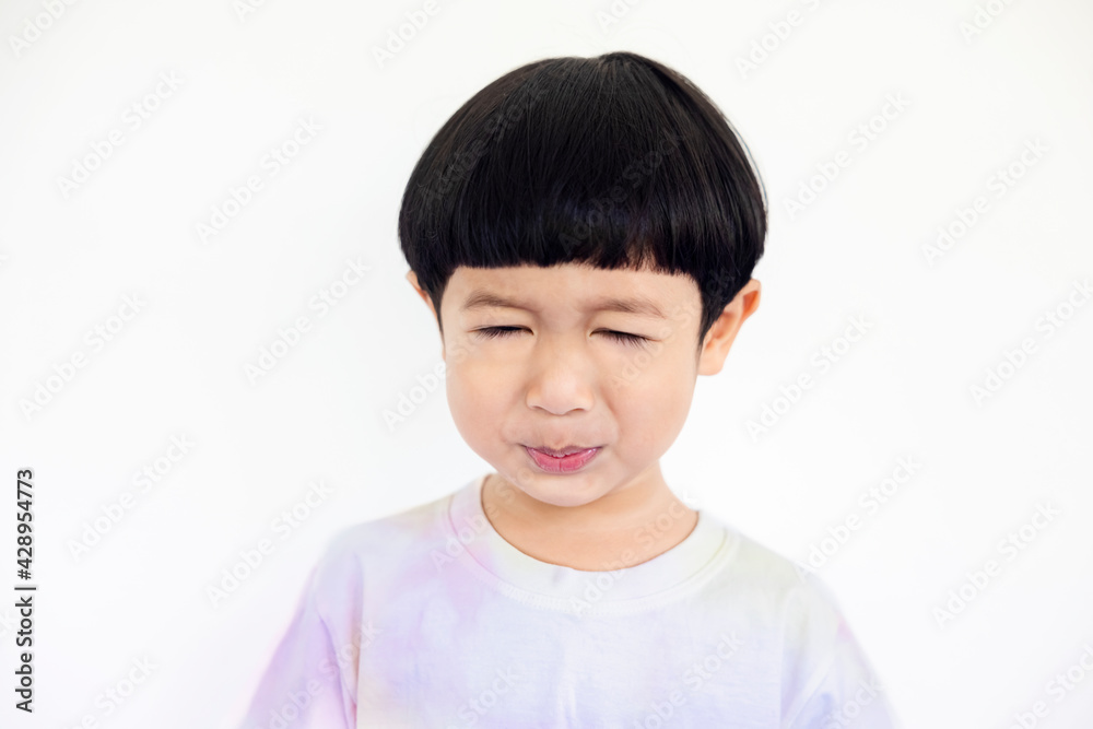 Close-up portrait Asian kids, Caucasian boy little child standing wearing a tie-dye shirt smiling and making a funny face at the camera on white background Close-up portrait Asian kids, Caucasian boy little child standing wearing a tie-dye shirt smiling and making a funny face at the camera on white background