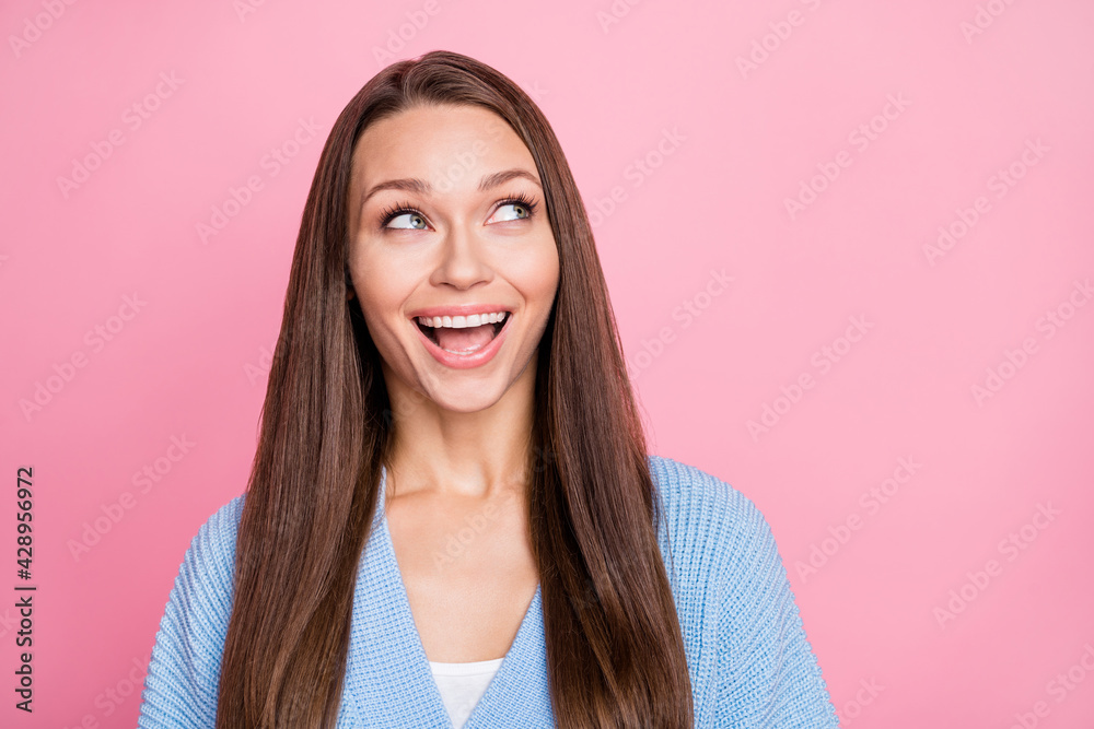 Photo of happy beautiful young woman look empty space dream sale isolated on pastel pink color background Photo of happy beautiful young woman look empty space dream sale isolated on pastel pink color background