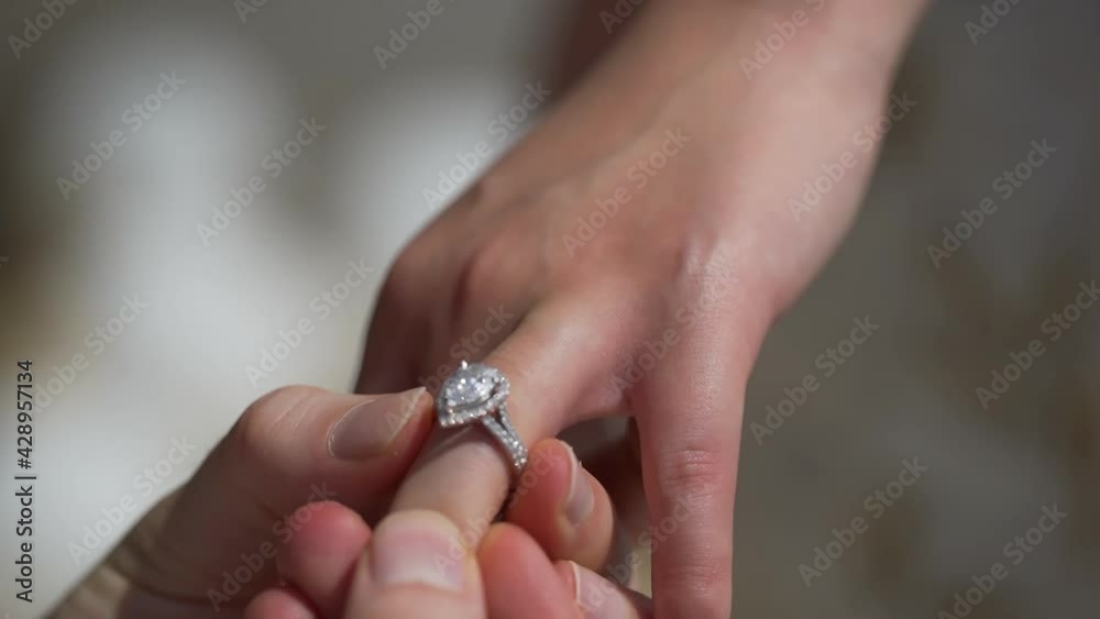 Husband Puts Ring on Wife's Finger Big diamonds Wedding engagement and proposal for the bride . Husband Puts Ring on Wife's Finger Big diamonds Wedding engagement and proposal for the bride .