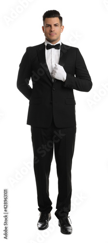 Handsome butler in elegant uniform on white background