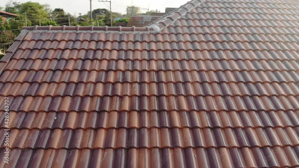 Modern brown roof of new house in suburban architech construction site aerial view Modern brown roof of new house in suburban architech construction site aerial view