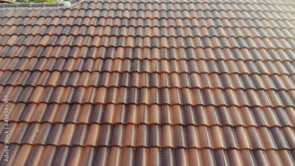 Modern brown roof of new house in suburban architech construction site aerial view Modern brown roof of new house in suburban architech construction site aerial view
