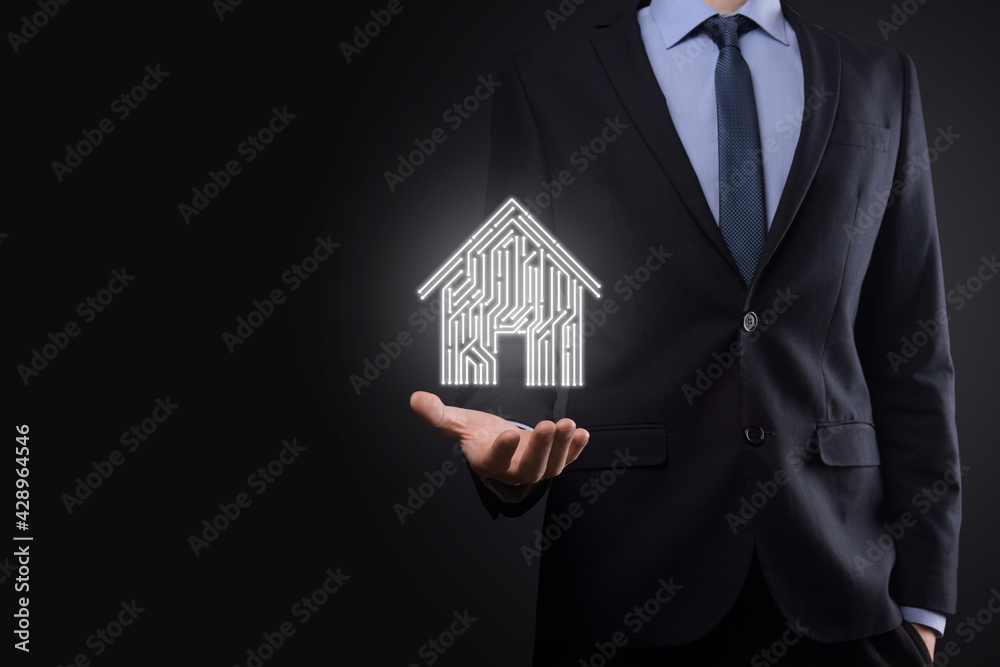Businessman hold house icon.Smart home controlled, intelligent house, and home automation app concept.Pcb design and person with smart phone. Innovation technology internet Network Concept. Businessman hold house icon.Smart home controlled, intelligent house, and home automation app concept.Pcb design and person with smart phone. Innovation technology internet Network Concept.