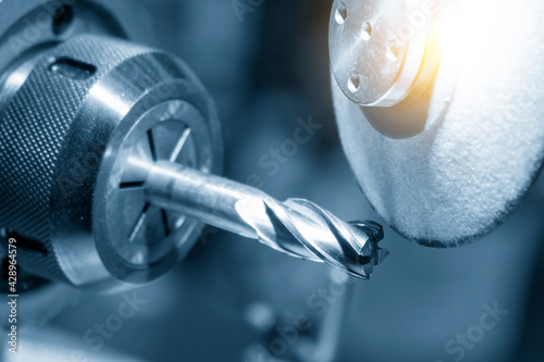 The flat end mill tool type regrinding process. The CNC milling cutting tool sharpening  process with abrasive stone wheel.