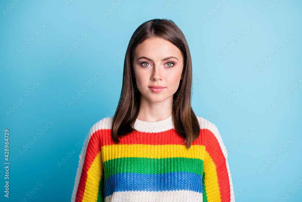 Photo of funny charming young woman dressed striped sweater smiling isolated blue color background Photo of funny charming young woman dressed striped sweater smiling isolated blue color background