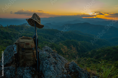 Backpack hiking in the mountains on the rocks photo