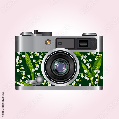 photo camera with lily of the valley decor
