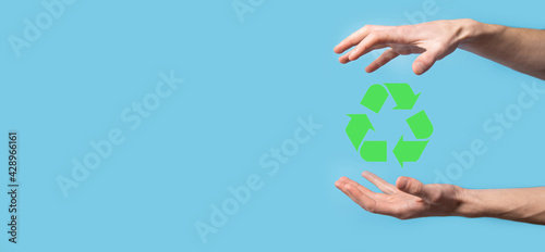 Hand hold recycling icon.Ecology and renewable energy concept.ECO sign, Concept Save green planet. Symbol of environmental protection.Recycling waste.Symbol of earth day, concept of nature protection