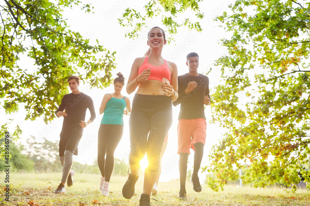 Running group jogging together for training Stock Photo | Adobe Stock