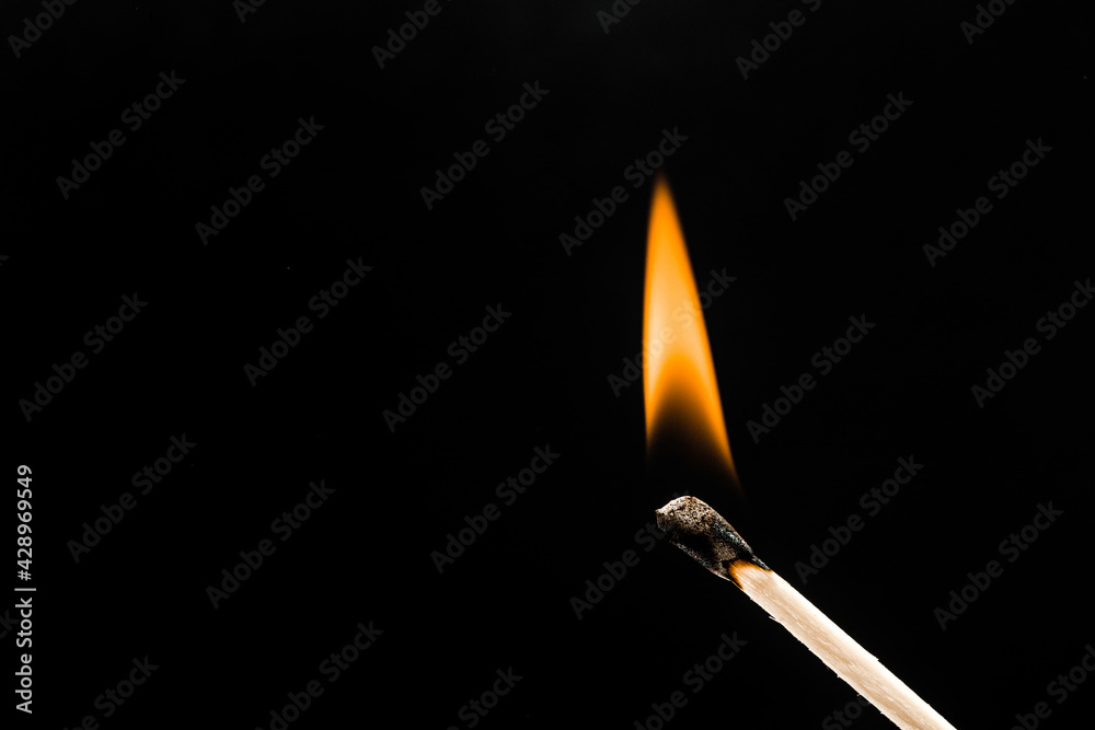 burning match on black background - Image burning match on black background - Image