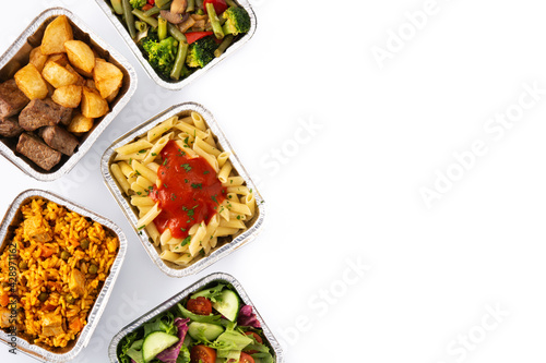 Take away healthy food in foil boxes isolated on white background. Copy space 