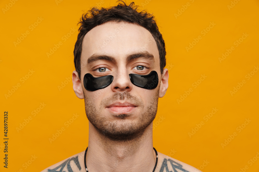 Close up of a shirtless mid aged brunette man Close up of a shirtless mid aged brunette man
