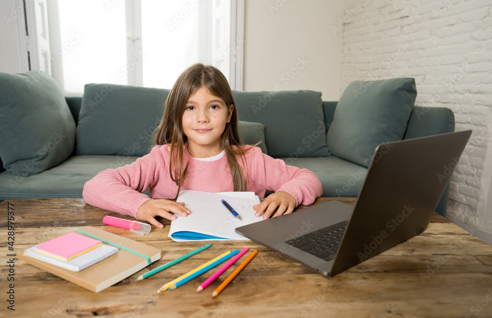 School girl with laptop studying online at home as school is closed due to new COVID-19 Lockdown School girl with laptop studying online at home as school is closed due to new COVID-19 Lockdown