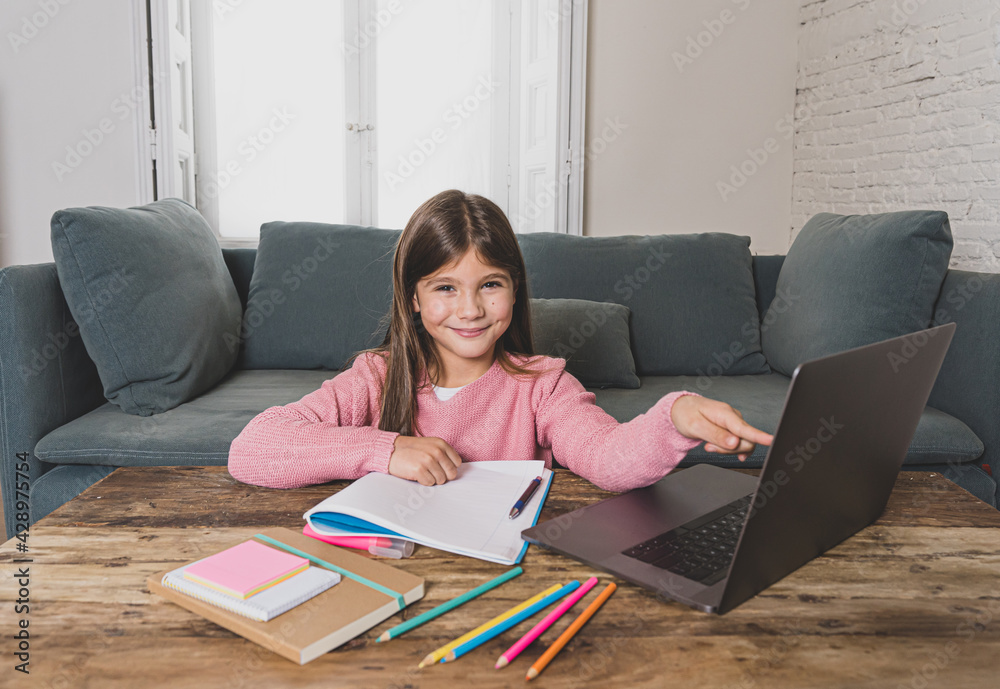 School girl with laptop studying online at home as school is closed due to new COVID-19 Lockdown School girl with laptop studying online at home as school is closed due to new COVID-19 Lockdown