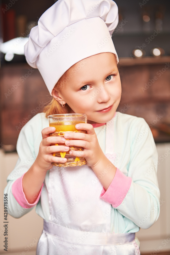 small cook with glass of juice small cook with glass of juice