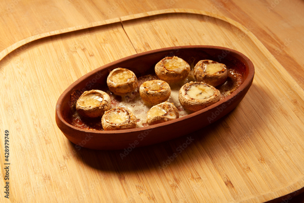 Baked white mushrooms in butter