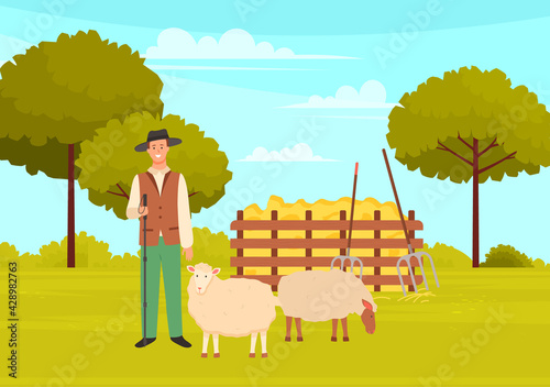 Young farmer man in hat standing near sheeps with shepherd s stick near farm animal, rural landscape