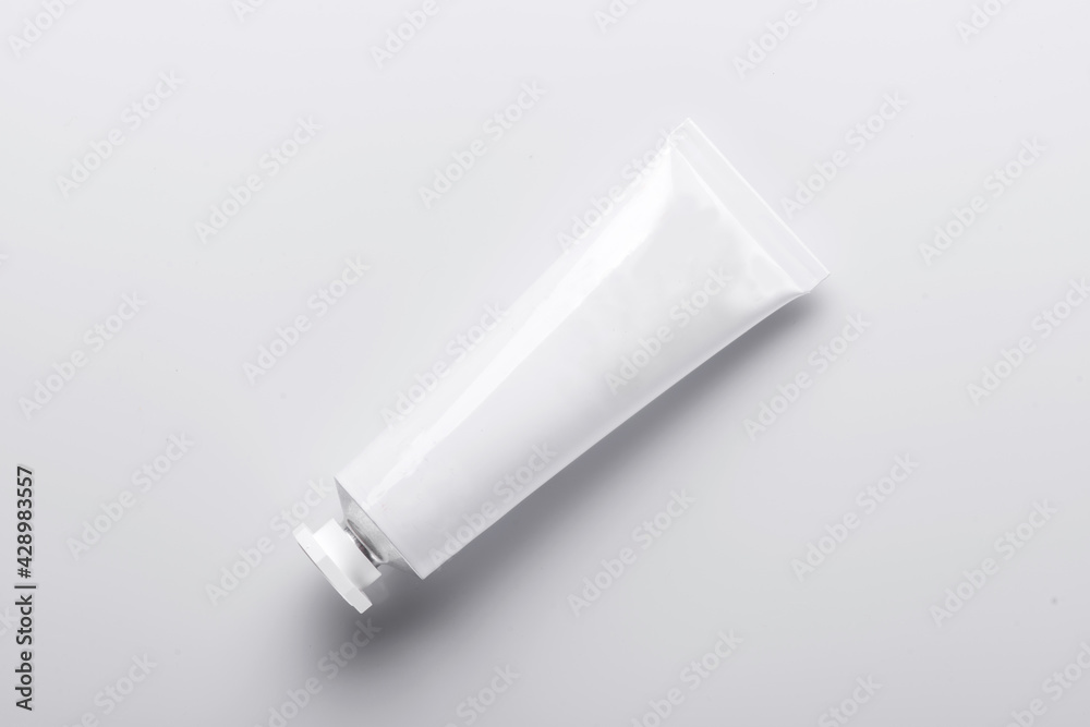 Top view of open blank cosmetic tube isolated on white Top view of open blank cosmetic tube isolated on white