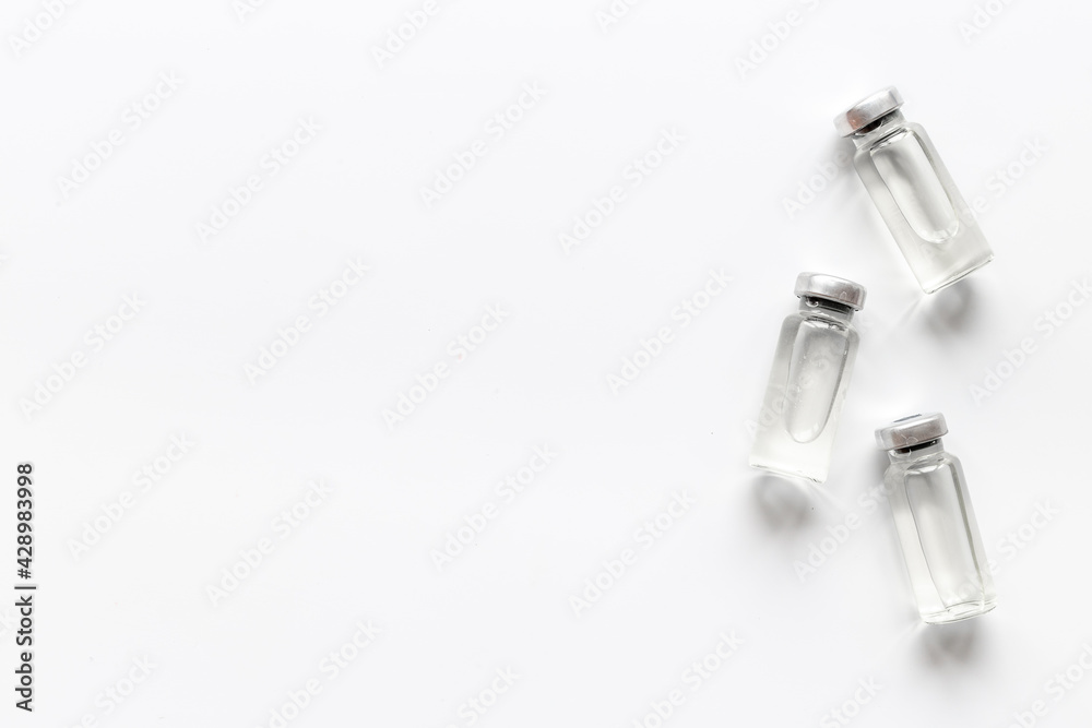 Naklejka premium Vaccine vials. Covid vaccine in bottles. Vaccination concept