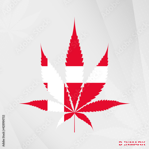 Flag of Denmark in Marijuana leaf shape. The concept of legalization Cannabis in Denmark.